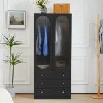 A black armoire with two arched glass doors revealing hanging clothes and three drawers.