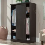 A dark brown wardrobe with two sliding doors, revealing shelves, a hanging rod, and drawers.
