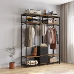 A metal clothing rack with wooden shelves, displaying folded clothes, hanging items, and accessories.