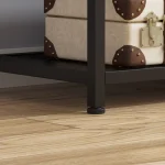 Detail of the adjustable feet on a clothing rack for stability and uneven surfaces.