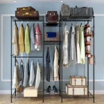 Modern clothing rack with a combination of metal and wood, showcasing a mix of storage options.