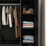 Modern wardrobe with a sleek black finish and ample storage space.