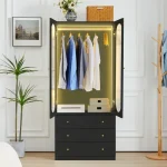 Modern wardrobe with a sleek black finish and interior LED lighting for improved visibility.