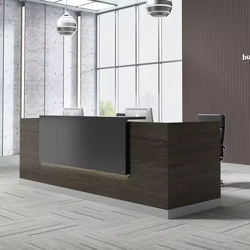 Linear custom made reception desk with a dark, ash-colored wood grain finish and a contrasting dark gray face